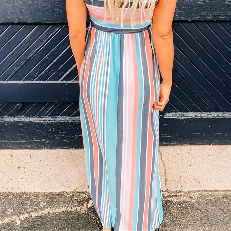 Model wearing loose fit striped high waist dress with short sleeves