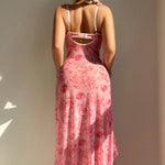 A strapless floral print dress with a slit, available in white, black, and pink.