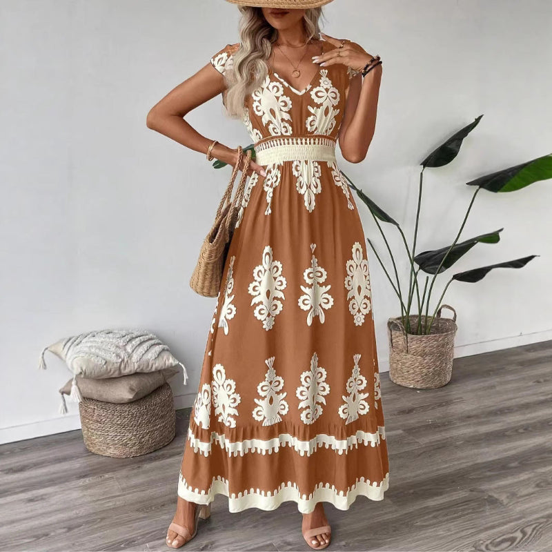 A stylish model wearing an elegant floral V-neck midi dress in a dark blue color. The dress has a waist-cinched design and a beautiful positional flower pattern, perfect for an elegant commuting style.
