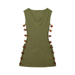 An elegant, sleeveless linen dress in a solid color with a stylish waist cut-out and a round neck.