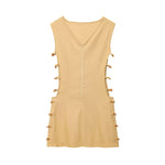 An elegant, sleeveless linen dress in a solid color with a stylish waist cut-out and a round neck.