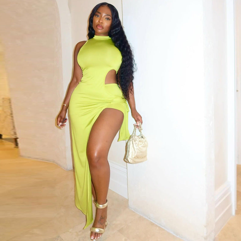 A sleeveless, high-neck midi dress with an irregular hem and side slit, shown in a vibrant yellow-green color.