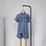 This denim suit features a stretchy elastic waist for bold style and comfortable wear.
