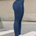 A pair of blue, high-waisted, skinny-fit denim jeans for women. The jeans are made from a stretchy fabric and have a tapered leg that ends at the ankle. They are suitable for a casual style.