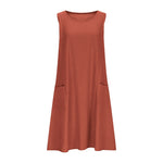 A sleeveless, mid-length A-line tank dress with a round neck.