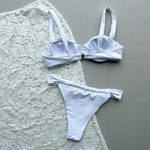 Turn heads with this bold three-piece bikini set designed to stand out at the beach or pool.