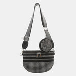 A medium-sized black crossbody bag made of PU material, adorned with metallic studs and featuring an adjustable strap.
