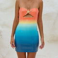 A sleeveless sequin-printed mini dress in vibrant pink, yellow, orange, green, and multicolor.