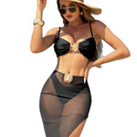 A model wearing a three-piece swimsuit set, which includes a bikini top, bikini bottoms, and a long mesh cover-up dress. The swimsuit is available in various colors and is shown in a beach setting.