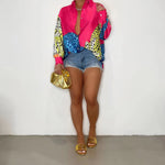 A loose-fit, long-sleeve shirt with a striking animal print pattern.