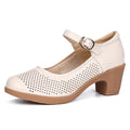 A pair of hollow sandals with a buckle closure, round toe, and low heel, showcasing the casual style and comfortable design.