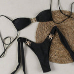 This bikini features thin straps and a tie-back design for a bold, confident beach look.