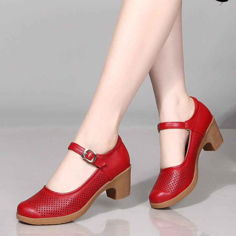 A pair of hollow sandals with a buckle closure, round toe, and low heel, showcasing the casual style and comfortable design.