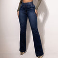 A person wearing dark blue high-waisted, button-up flared jeans, showcasing the full length and a comfortable fit.