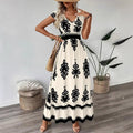 A stylish model wearing an elegant floral V-neck midi dress in a dark blue color. The dress has a waist-cinched design and a beautiful positional flower pattern, perfect for an elegant commuting style.