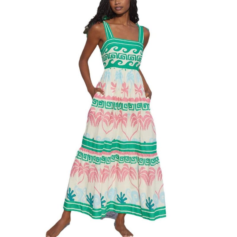 A green, sleeveless, one-shoulder bandage midi dress with bow tie suspenders, shown on a mannequin from the front.