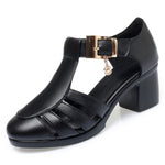 A pair of new style hollow sandals with a round toe and low heel, featuring a buckle closure and two-layer cowhide material.