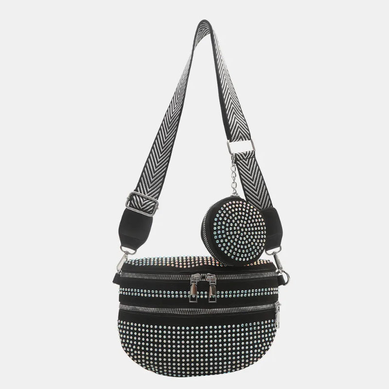 A medium-sized black crossbody bag made of PU material, adorned with metallic studs and featuring an adjustable strap.
