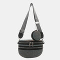 A medium-sized black crossbody bag made of PU material, adorned with metallic studs and featuring an adjustable strap.
