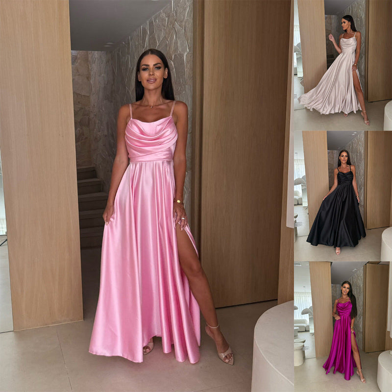 A black pleated strapless A-line midi dress with a side slit, displayed on a mannequin, highlighting its elegant design and flow.