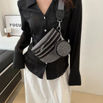 A medium-sized black crossbody bag made of PU material, adorned with metallic studs and featuring an adjustable strap.
