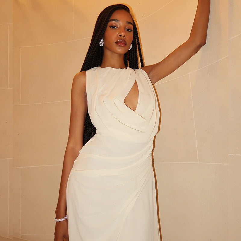 An elegant, sleeveless long dress with a high neck and pleated texture.
