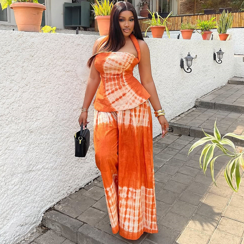 Backless printed long dress set with a halter neckline, a two-piece set for women, available in orange and navy blue.