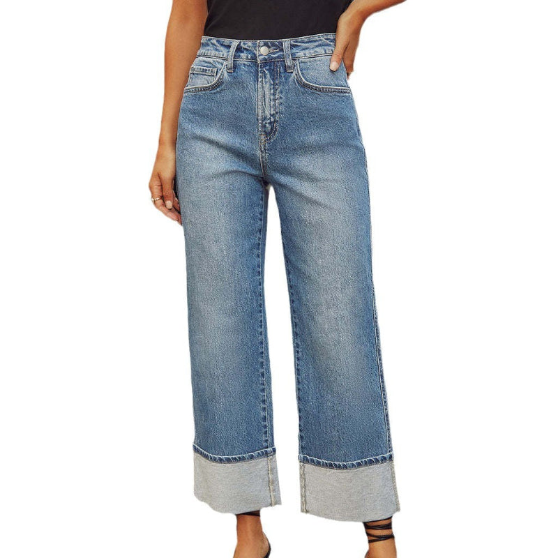 A pair of light blue, faded, straight leg high-waisted jeans for women.