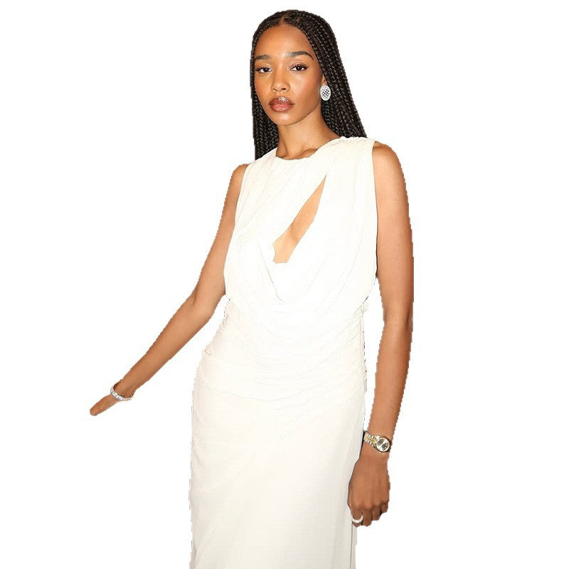 An elegant, sleeveless long dress with a high neck and pleated texture.