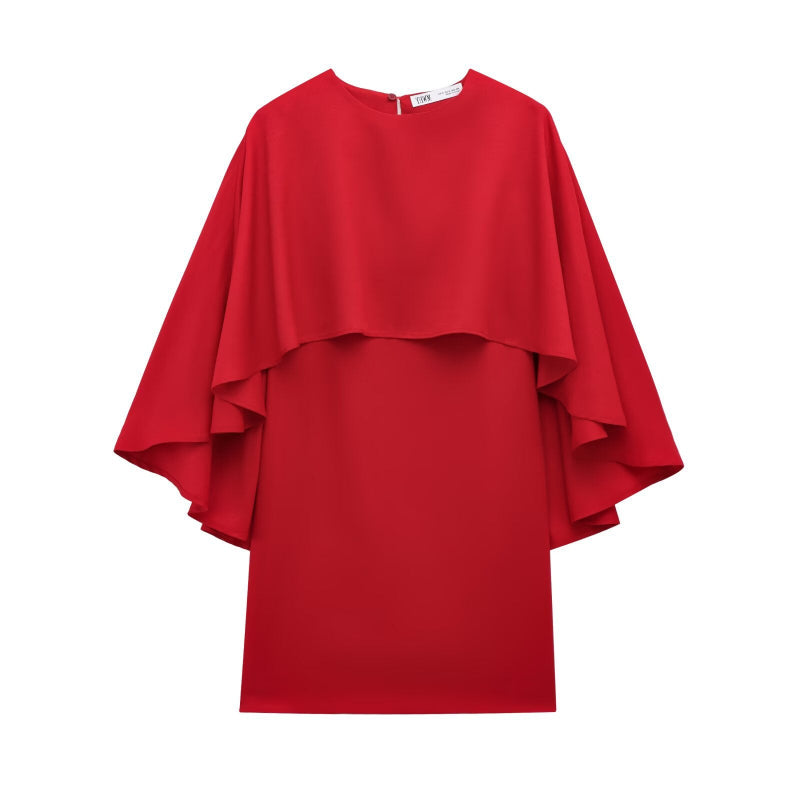 This short dress features a bold, loose cape design that makes a striking statement with effortless style.