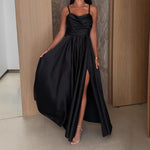A black pleated strapless A-line midi dress with a side slit, displayed on a mannequin, highlighting its elegant design and flow.