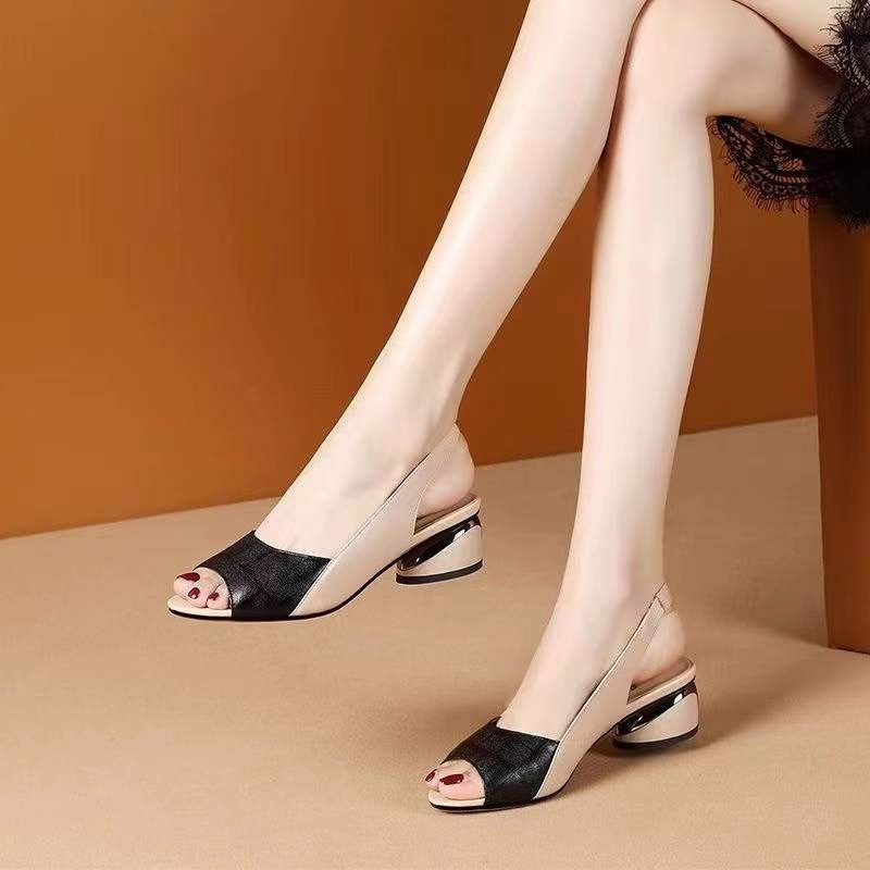 A close-up of a pair of black slip-on mid-heel sandals with a pointed toe, alongside other colors like brown, green, and red, suitable for casual wear.