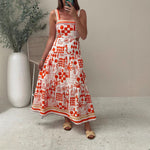 A model wearing a floral print colorblock strapless long dress with a one-shoulder design.