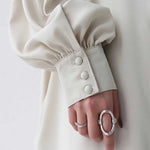 Black or apricot lantern sleeve single-breasted long dress made of chiffon with a solid color, round neck, puff long sleeves, and loose waist, available in one size.
