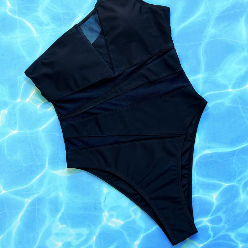 Make a bold statement with this daring mesh one-piece swimsuit, perfect for turning heads and feeling confident.