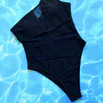 Make a bold statement with this daring mesh one-piece swimsuit, perfect for turning heads and feeling confident.