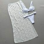 Turn heads with this bold three-piece bikini set designed to stand out at the beach or pool.