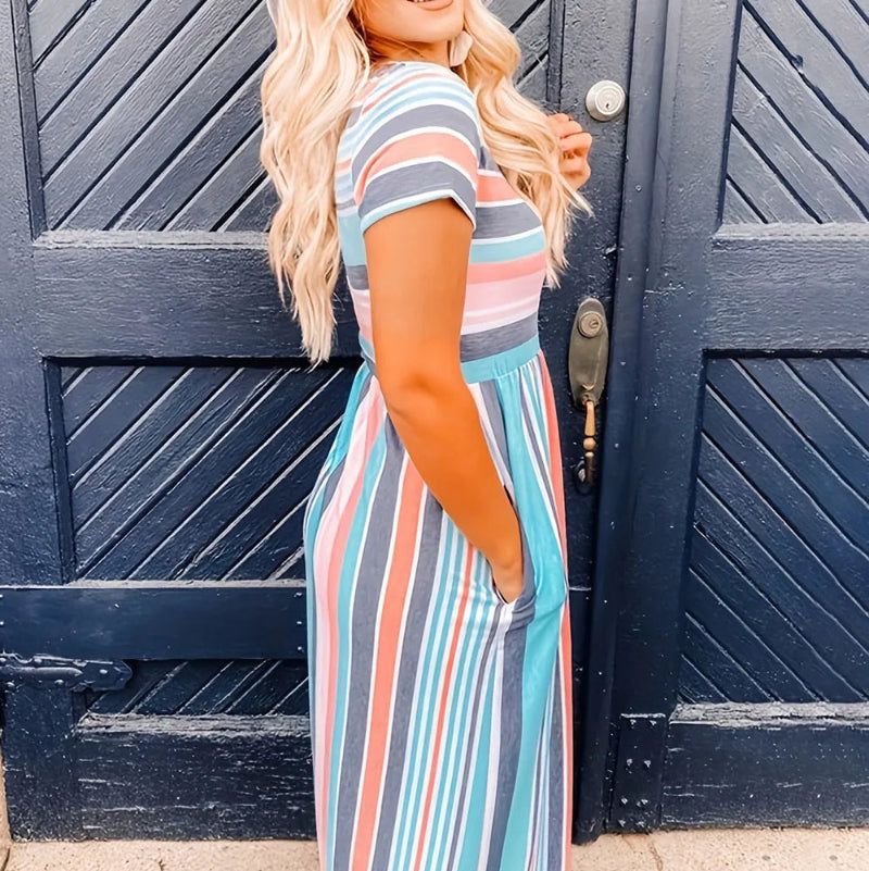 Model wearing loose fit striped high waist dress with short sleeves