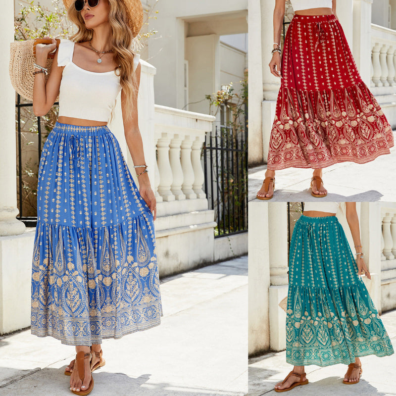 A woman wearing a vibrant, red, flared hem midi skirt with a high waist and pleated details.