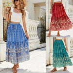 A woman wearing a vibrant, red, flared hem midi skirt with a high waist and pleated details.