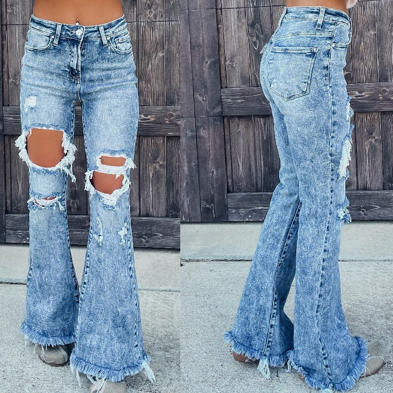 Distressed water washed micro flared jeans - runwayfashionista.com