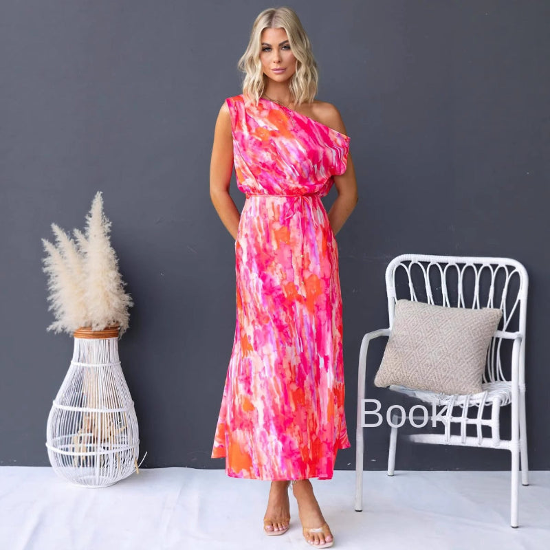 Model wearing a light blue split sleeveless printed midi dress with elegant flair in outdoor setting