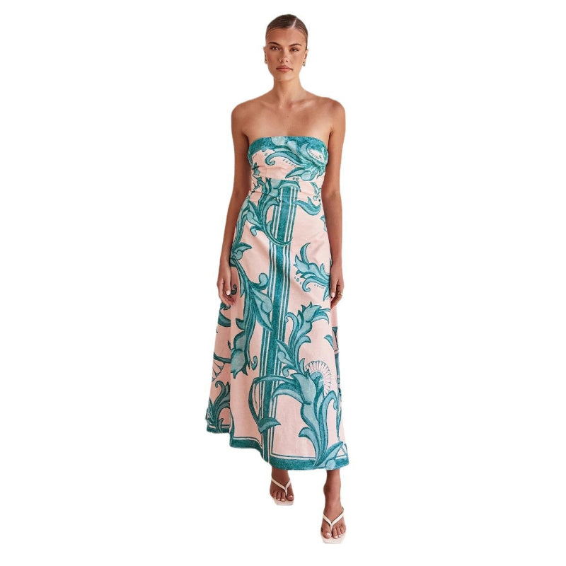 A model wearing a slim-fit, strapless, printed midi dress with a one-shoulder collar, suitable for casual wear.