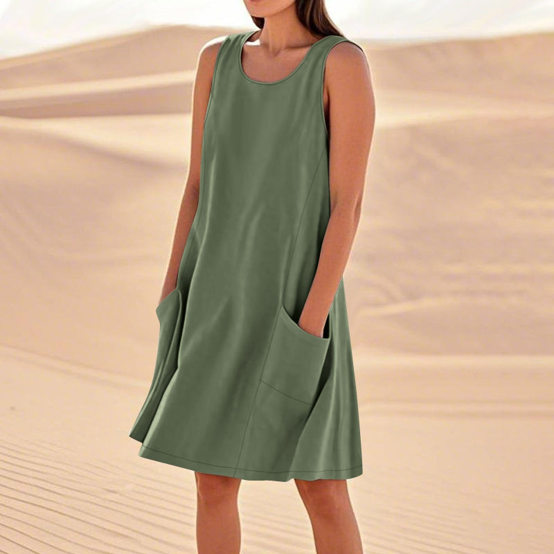 A sleeveless, mid-length A-line tank dress with a round neck.