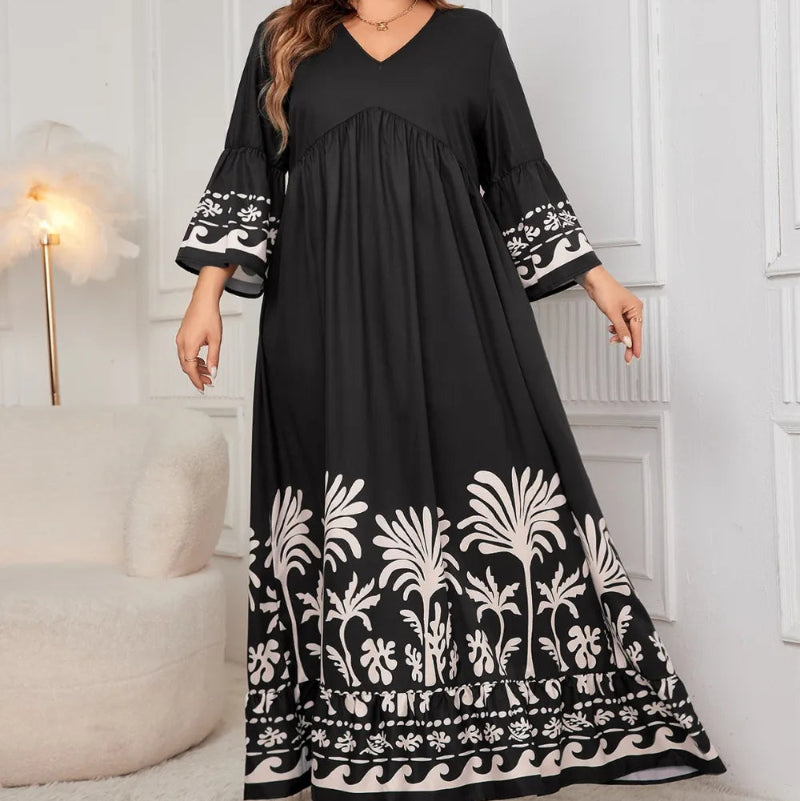 Honey Plus Size Printed V-Neck Long Sleeve Maxi Dress. Elegant V-neck, all-over print, long sleeves, comfortable stretch fabric.