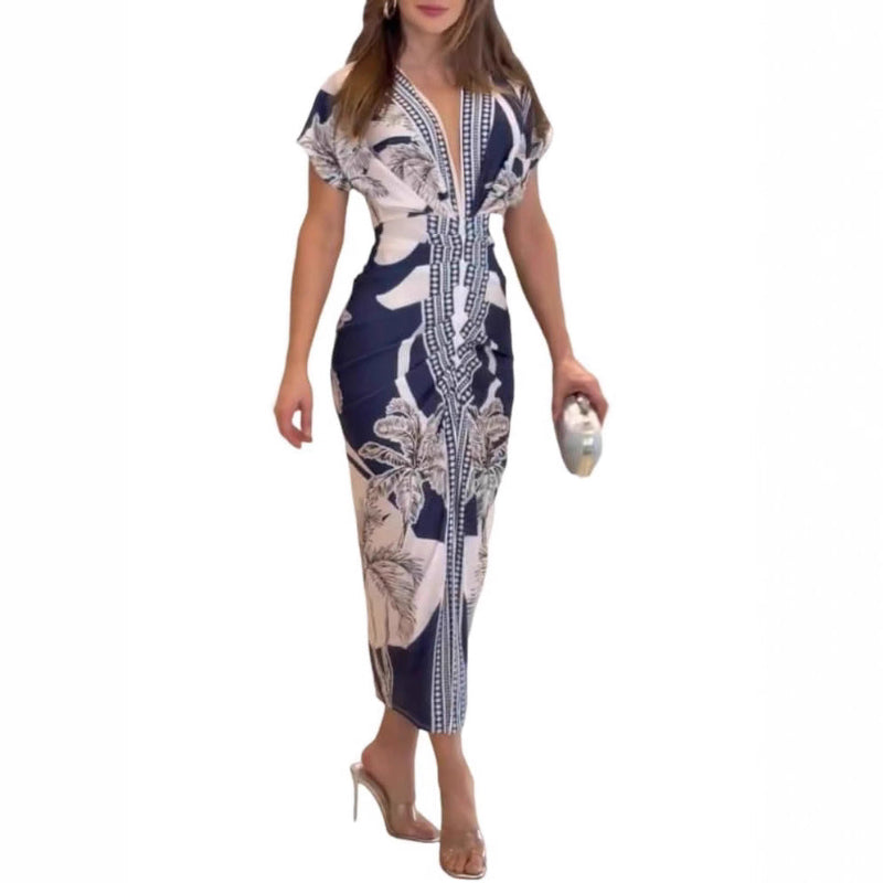 Woman wearing a patterned dress on a white background